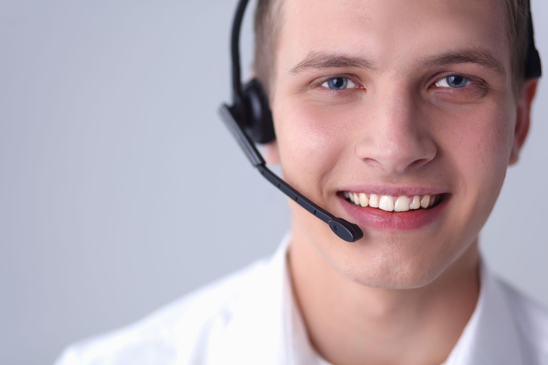 Customer support operator with a headset on white background