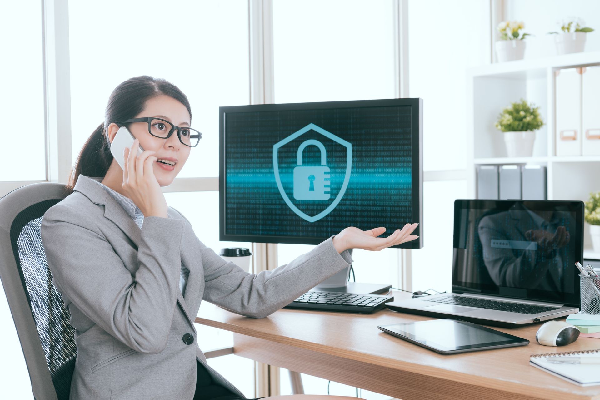 smiling professional business woman using mobile phone talking with customer explaining company online information security importance.