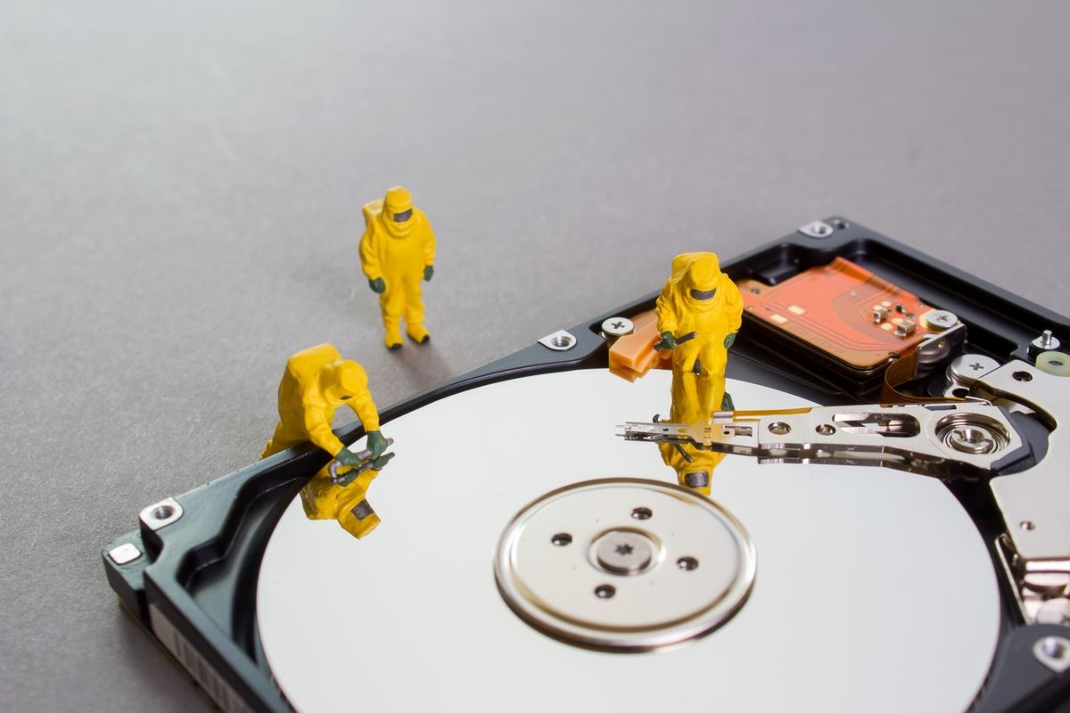 A team of workers remodeled the hard drive. Testing and checking the HDD. Restoration of lost information.